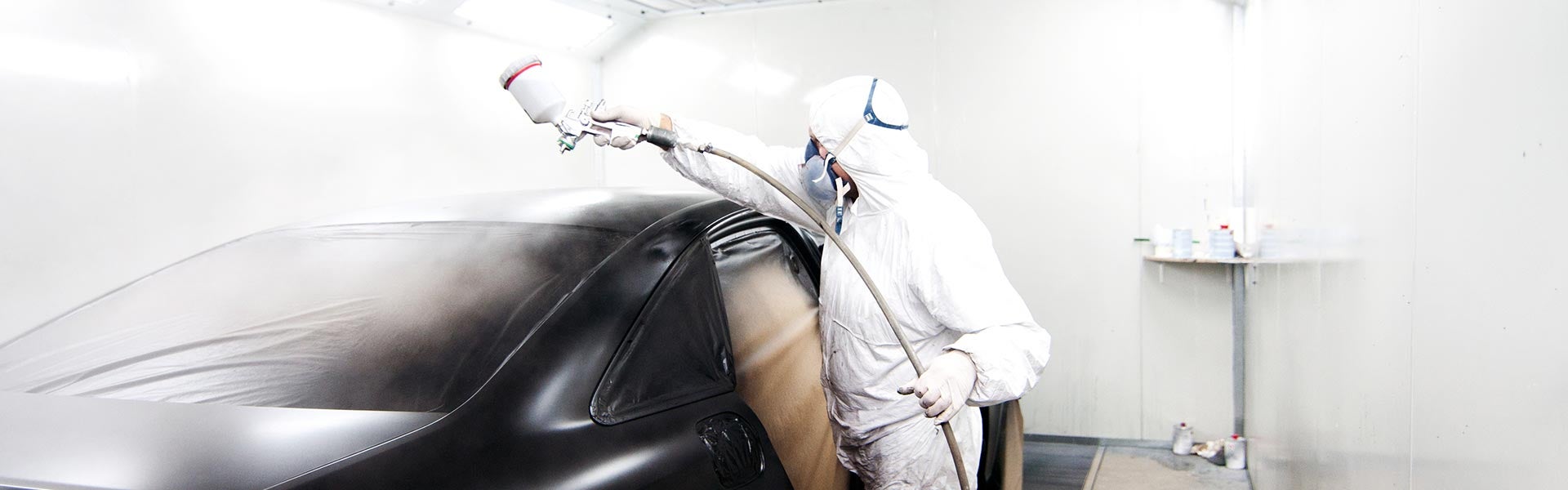 service tech painting car Miller Auto Body Shop in St. Cloud MN