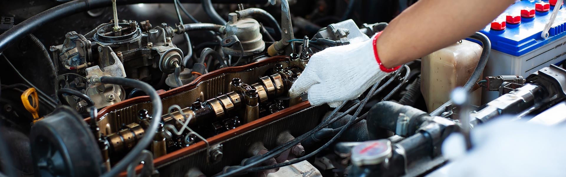 service tech working on car Miller Auto Body Shop in St. Cloud MN